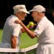 two elderly tennis players meeting at the net for a lively discussion. Exercise for elderly. Activities for elderly.