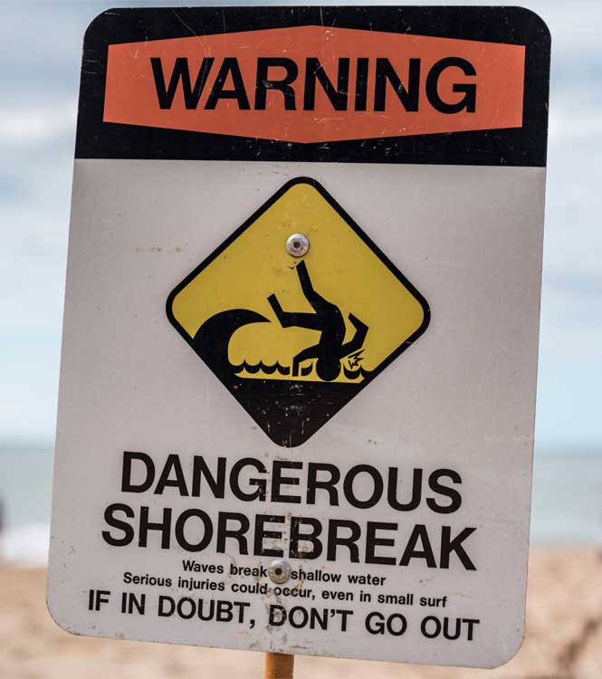 Sign showing risk of injury to surfers when surfing.