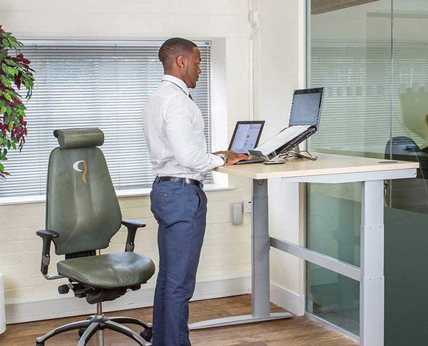 image of man at standing desk