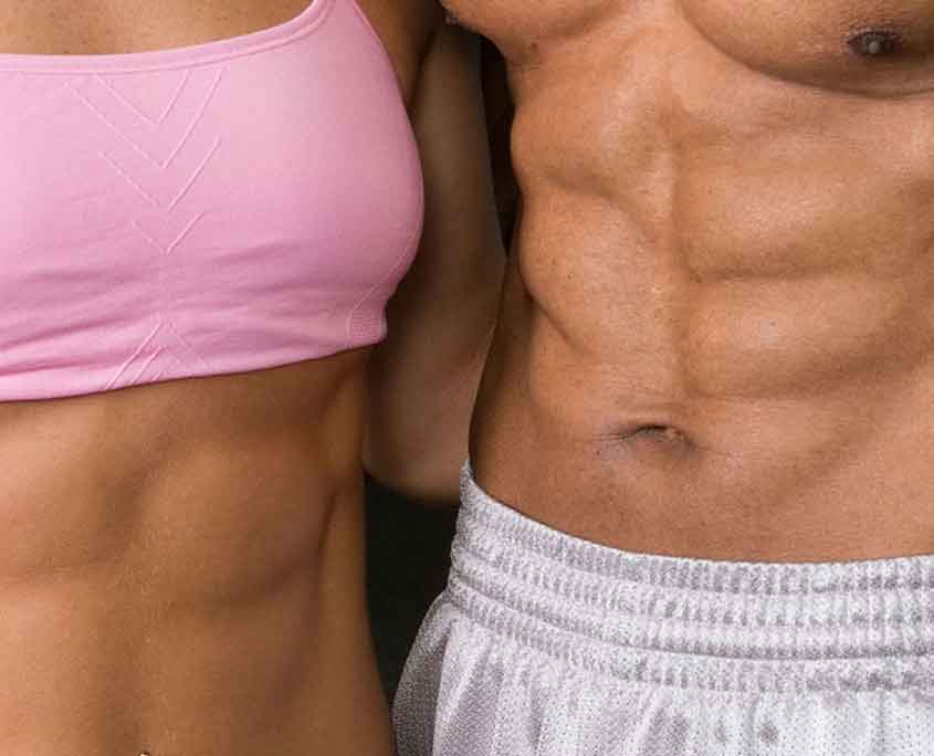 image of man and woman looking good with toned abs