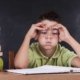 image of a boy struggling with homework due to learning disability ADHD dyslexia
